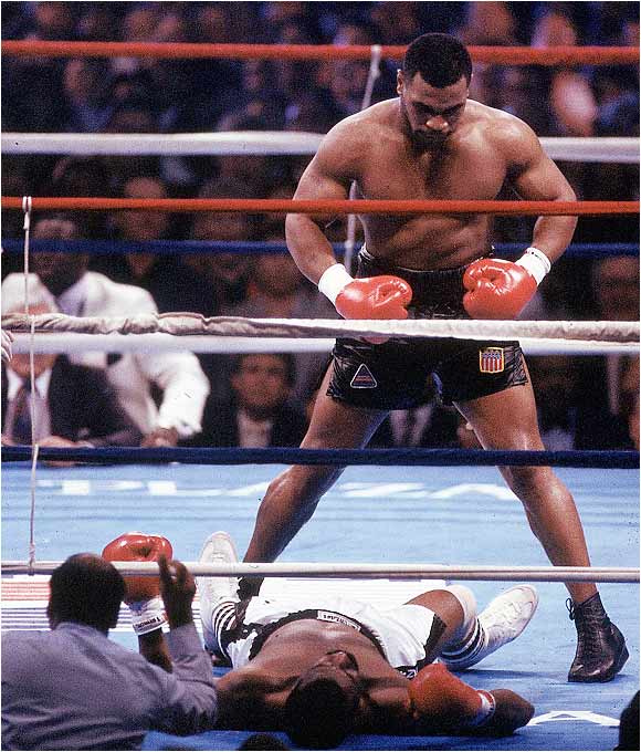 mike tyson knockout pictures. Tyson standing over Michael